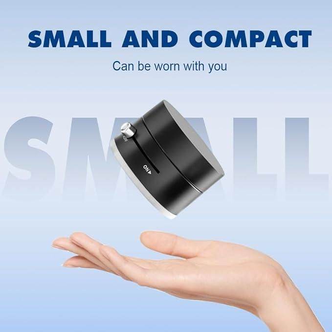 Product image of a small, black, round electronic device with an on/off switch, hovering over a hand, with text above that says "SMALL AND COMPACT".