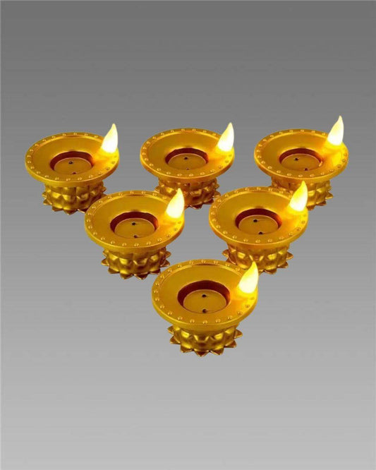 Set of six golden LED water pouring diya light candles with flickering flame effect