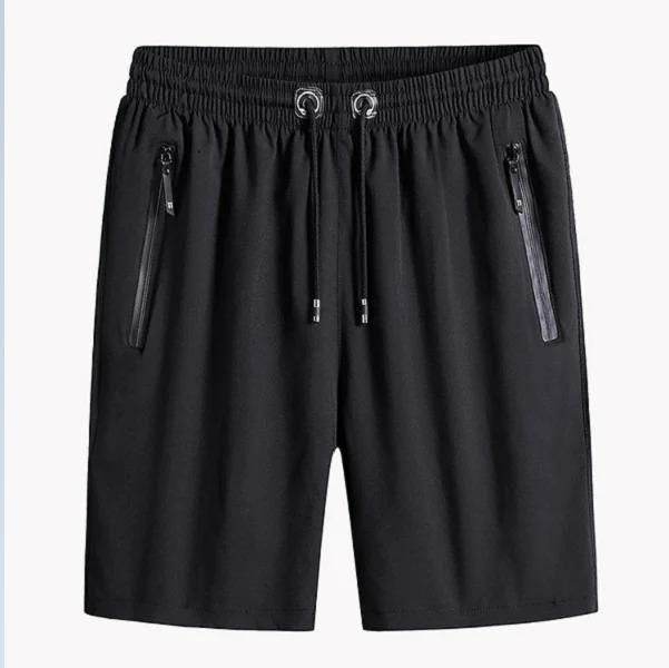 Black athletic shorts with drawstring and zippered pockets.
