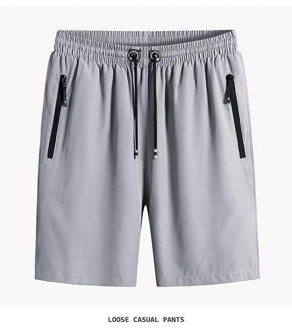 Gray casual shorts with an elastic waistband and black zippers on the pockets.